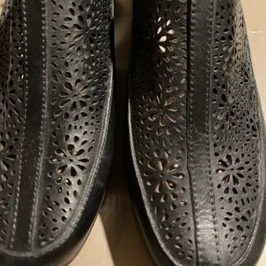 Sling back black shoes.